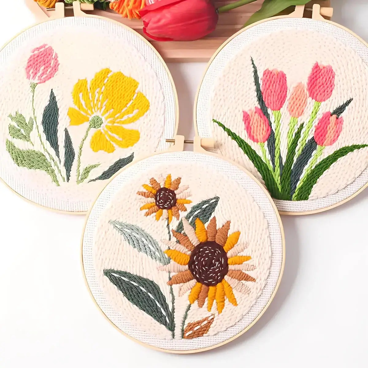 CraftHoop Garden Joy Punch Needle Kit featuring vibrant floral designs of tulips and sunflowers.