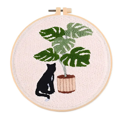 CraftHoop Cat & Plant Lovers Punch Needle Kit featuring a black cat and a lush plant design.